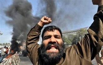 An activist of former premier Nawaz Sharif's Pakistan Muslim League-Nawaz party during a protest in Lahore on February 25.[Arif Ali/AFP]