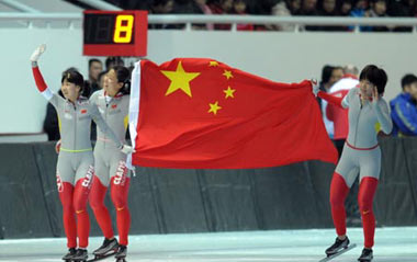 Athletes of China celebrate after the women's team pursuit final of speed skating in the 24th World Winter Universiade in Harbin, capital city of northeast China's Heilongjiang Province, Feb. 26, 2009. The team of China claimed the title with a time of 03:07.38.