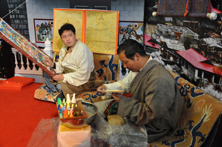 Tibetan craftsmen create butter sculptures at the 50th Anniversary of Democratic Reforms in Tibet Exhibition, which runs from Feb. 24 to Apr. 10 in the Exhibition Center of the Cultural Palace of Nationalities, Beijing. 