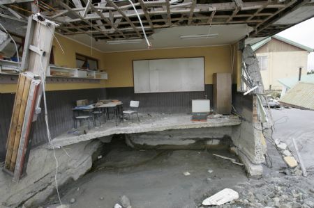 Photo taken on Feb. 26, 2009 shows a destroyed house after the eruption of Chaiten volcano near Chaiten town, located some 1,200 km south of Santiago, Chile. The Chaiten volcano, which started erupting on Feb. 19, has buried the neighboring towns under a blanket of ashes.