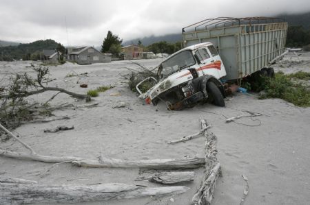 Streets are covered with ashes after the eruption of Chaiten volcano near Chaiten town, located some 1,200 km south of Santiago, Chile, Feb. 26, 2009. The Chaiten volcano, which started erupting on Feb. 19, has buried the neighboring towns under a blanket of ashes.