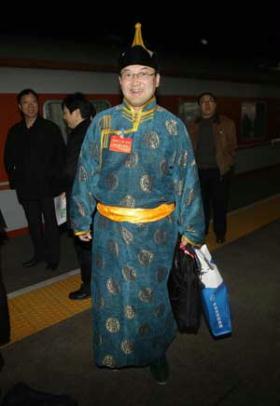 A member of the 11th National Committee of the Chinese People's Political Consultative Conference (CPPCC) from north China's Inner Mongolia Autonomous Region arrives in Beijing, capital of China, March 1, 2009.[Xing Guangli/Xinhua]