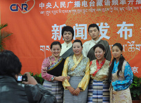 Working staff members of the Tibetan language frequency of China National Radio (CNR) takes group photo after a press conference in Beijing, capital of China, on Feb. 28, 2009. Tibetan language frequency is the 11th, and the latest established frequency of CNR. It will start broadcasting on March 1, 2009, with 18 hours programs one day.