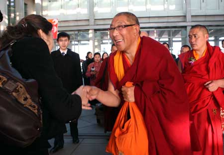 Members of the 11th National Committee of the Chinese People's Political Consultative Conference (CPPCC) from southwest China's Tibet Autonomous Region arrive in Beijing, capital of China, March 1, 2009.