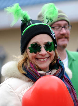 A woman attends the parade in Queens of New York, the United States, on March 1, 2009, prior to the Saint Patrick's Day. Saint Patrick's Day parades are now held throughout not only Ireland but also countries with big emigrant communities like the United States and Britain. The Saint Patrick's Day falls on March 17 annually.