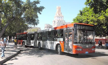 A bus made by a Chinese producer runs in Havana, Cuba, Feb. 28, 2009. In Havana, weckers, trikes, carriages along with buses and taxis compose the city's main public transportation system. These vehicles witnessed the city's development and change.