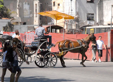 A carriage runs in Havana, Cuba, Feb. 28, 2009. In Havana, weckers, trikes, carriages along with buses and taxis compose the city's main public transportation system. These vehicles witnessed the city's development and change. 