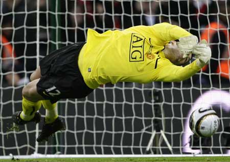 Ben Foster of Manchester United makes a save from Tottenham Hotspur's Jamie O'Hara during the penalty shootout in the English League Cup final soccer match at Wembley Stadium in London, Sunday, March 1, 2009. 