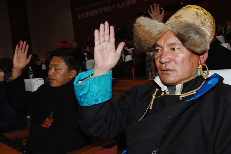 Representatives of the Tibetan ethnic group vote during an election in southwest China