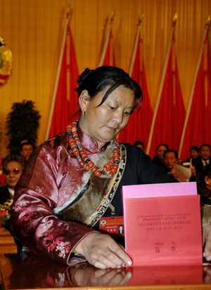 A woman of the Tibetan ethnic group votes during an election in southwest China's Tibet Autonomous Region, Jan. 20, 2008.