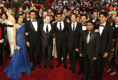 The cast and crew of best picture nominee 'Slumdog Millionaire' arrive at the 81st Academy Awards in Hollywood, California February 22, 2009. Left to right are actors Freida Pinto, Irrfan Khan, writer Simon Beaufoy, actor Madhur Mittal, producer Christian Colson, actor Anil Kapoor, composer A.R. Rahman, actor Dev Patel. 