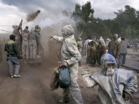 Revellers celebrate Clean Monday by participating in a colorful 'flour-war', a traditional activity marking the end of the carnival season, in the port town of Galaxidi, some 200km (125 miles) northwest of Athens Mach 2, 2009.