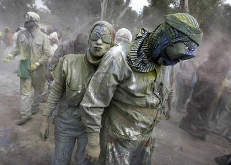 Revellers celebrate Clean Monday by participating in a colorful 'flour-war', a traditional activity marking the end of the carnival season , in the port town of Galaxidi, some 200km (125 miles) northwest of Athens Mach 2, 2009.