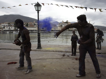 Revellers celebrate Clean Monday by participating in a colorful 'flour-war', a traditional activity marking the end of the carnival season, in the port town of Galaxidi, some 200km (125 miles) northwest of Athens Mach 2, 2009.