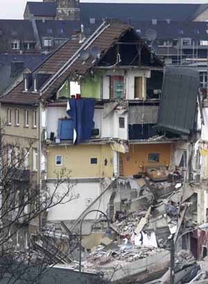 The remains of a house next to where the former town archive of the German city of Cologne collapsed, is pictured in Cologne March 3, 2009.