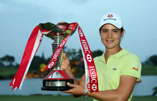 Under threat? Lorena Ochoa poses with the winner's trophy after the final round of the inaugural HSBC Women's Champions in Singapore. [Ross Kinnaird/Getty Images] 