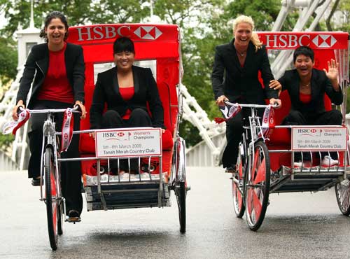 (L-R) Lorena Ochoa of Mexico, Inbee Park of Korea, Suzann Pettersen of Norway, and Yani Tseng of Chinese Taipei share a laugh on trishaws at the HSBC Women's Champions. (Photo by Andrew Redington/Getty Images)