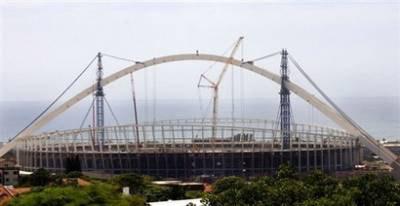 Engineers work on Durban's Moses Mabhida 2010 World Cup stadium. South Africa's economy shrank for the first time in a decade, contracting 1.8% in the fourth quarter of 2008, hit by a slowdown in manufacturing, Statistics SA has said.[Rajesh Jantilal/AFP/File]