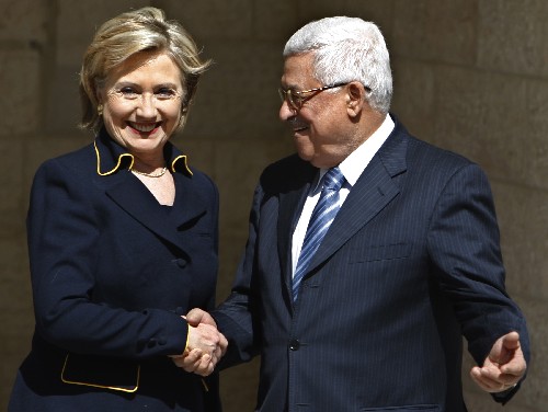 Palestinian National Authority (PNA) Chairman Mahmoud Abbas (R) shakes hands with visiting U.S. Secretary of State Hillary Clinton in the West Bank city of Ramallah, on March 4, 2009. 