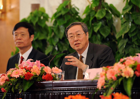 Zhou Xiaochuan (right), governor of the People's Banck of China, or the central bank, answers questions during a press conference on the sidelines of the 2nd session of the 11th NPC in Beijing, March 6, 2009. [Xinhua]