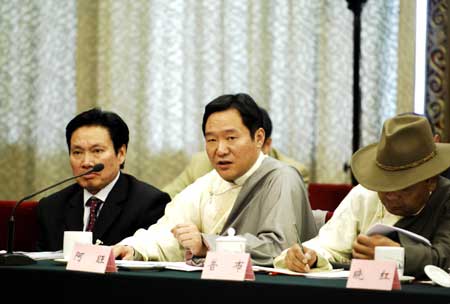Deputies to the Second Session of the 11th National People's Congress (NPC) from southwest China's Tibet Autonomous Region deliberate the government work report in Beijing, capital of China, March 6, 2009. (Xinhua/Yin Dongxun) 