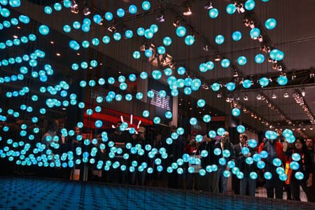 Visitors watch a presentation about cloud computing at the IBM booth at the CeBIT IT trade show in Hanover, Germany, March 4, 2009. The world