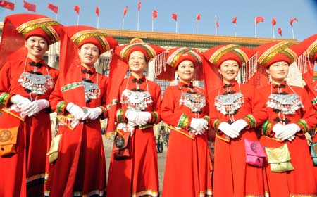 Attendants take photos outside the Great Hall of the People in Beijing, capital of China, March 5, 2009. The Second Session of the 11th National People's Congress (NPC) opened on Thursday. 