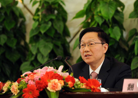Chinese Finance Minister Xie Xuren answers questions during a press conference on dealing with the global financial crisis and maintaining steady and relatively rapid economic growth held by the Second Session of the 11th National People's Congress (NPC) at the Great Hall of the People in Beijing, capital of China, March 6, 2009. 