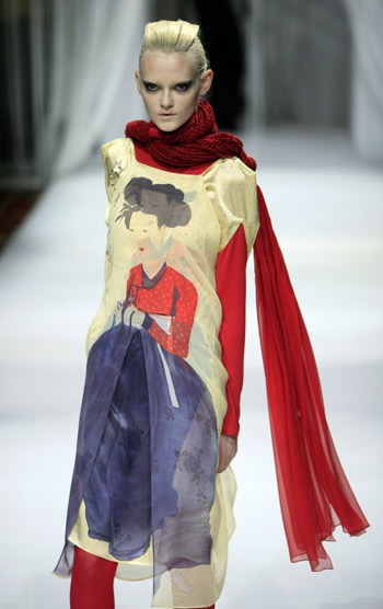 A models displays fashionable dress by Japanese designer Hiroko Koshino during the Paris Fashion Week in Paris, March 5, 2009. More and more designers from Asia appear at the fashion week, bringing works featuring Asian arts. 