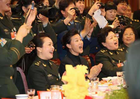 Women members of the National Committee of the Chinese People's Political Consultative Conference (CPPCC) from People's Liberation Army of China attend celebrations for the International Women's Day on March 7, 2009. 