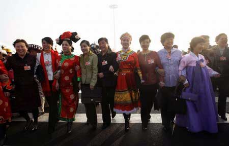 Female delegates walk towards the Great Hall of the People as they arrive for a plenary session of the Chinese People's Political Consultative Conference (CPPCC) in Beijing March 7, 2009. International Women's Day is marked on March 8 every year.