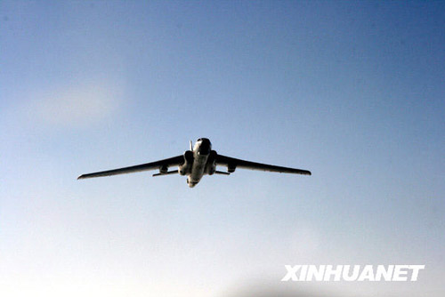 A PLA Air Force bomber flies over the Yellow River in Inner Mongolia Autonomous Region on Saturday March 7, part of a ice-jam flood prevention mission. [Photo: Xinhuanet]
