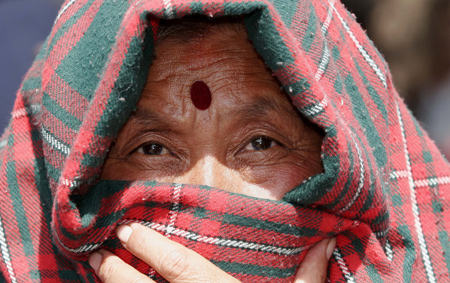 A Nepali woman in traditional dress takes part in a celebration to mark the International Women's Day in Nepal's capital Kathmandu on March 8, 2009. The main theme of the International Women's Day for Nepal this year is 'Voice of All Nepalis: Drafting Women-friendly Constitution.' 