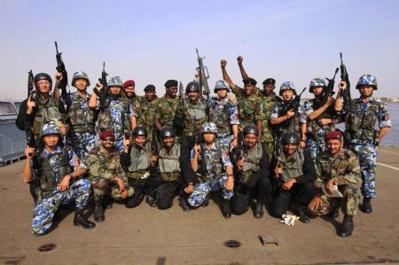 Chinese, Pakistani and Nigerian marine special force corps have group photos taken during the multinational Naval Peace Exercise 'Aman 09' in Pakistan, March 7, 2009. The Pakistan Navy's multinational Naval Peace Exercise 'Aman 09' began on Friday in the southern port city of Karachi. The navies of a total of 12 countries took part in the exercises with their battleships, maritime aircraft and other forces.