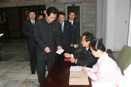 Voters line up to get their ballots in Pyongyang, capital of the Democratic People's Republic of Korea (DPRK), March 8, 2009. An election of the members of the 12th Supreme People's Assembly (SPA) started Sunday in DPRK.