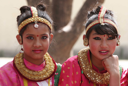 Two Nepali girls in traditional dress takes part in a celebration to mark the International Women's Day in Nepal's capital Kathmandu on March 8, 2009. The main theme of the International Women's Day for Nepal this year is 'Voice of All Nepalis: Drafting Women-friendly Constitution.' 