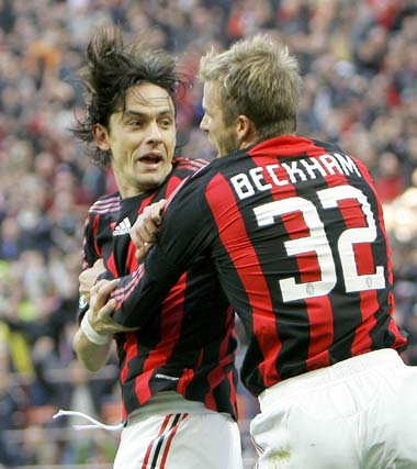 AC Milan striker Filippo Inzaghi (left) celebrates with teammate David Beckham after scoring against Atalanta during their Serie A match on Sunday. [Shanghai Daily]