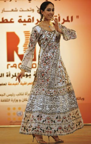 A model displays a creation by designers from Iraqi Fashion House during a celebration of International Woman Day in Baghdad March 8, 2009.