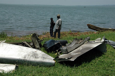 Wreckage of a crashed cargo plane is placed on lakeshore at Entebbe, 40km south of Kampala, on March 9, 2009. An Illyushin 76 cargo aircraft crashed in Lake Victoria, about 10 km south of Uganda's Entebbe international airport. 11 people aboard were feared dead in the Monday morning tragedy. Salvage efforts are underway. (Xinhua/Ronald Ssekandi) 