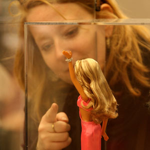 A woman points at a Barbie doll at the Bloomingdale shopping center in New York, March 9, 2009. The Barbie doll which debuted on March 9, 1959, celebrated its 50th anniversary worldwide on Monday. (Xinhua/Liu Xin) 
