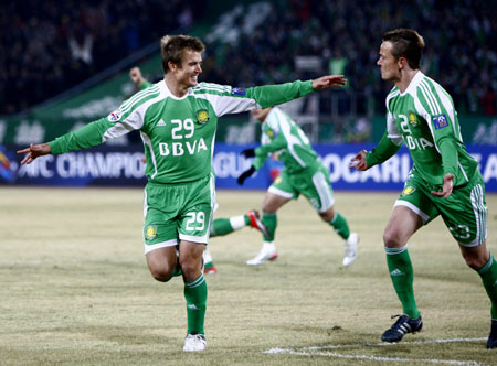 Griffiths Ryan Alan (R) of China's Beijing Guo'an jubilates with his teammate Griffiths Joel Michael after a goal during the AFC Champions League group E round against Australia's Newcastle Jets in Beijing, capital of China, on March 10, 2009. Beijing Guo'an won 2-0.[Xinhua]