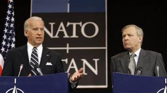 U.S. Vice President Joe Biden, left, gestures while speaking during a media conference at NATO headquarters in Brussels, Tuesday March 10, 2009.[Virginia Mayo/CCTV/AP Photo] 