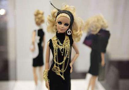 An exhibition of Barbie dolls is held at the pret-a-porter Paris Fair in Paris, France, March 7, 2009. Fifty designers from all over the world created 50 pieces of dresses and accessories for Barbie doll which debuted on March 9, 1959, to celebrate her 50th birthday.[Zhang Yuwei/Xinhua] 