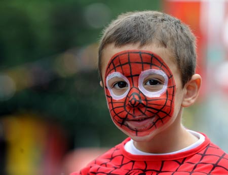 A boy dressed as Spiderman attends the annual Purim Festival Parade in Holon, south of Tel Aviv, March 10, 2009. Jewish people celebrated their Purim Festival from March 10 to 11 this year. (Xinhua/Yin Bogu) 