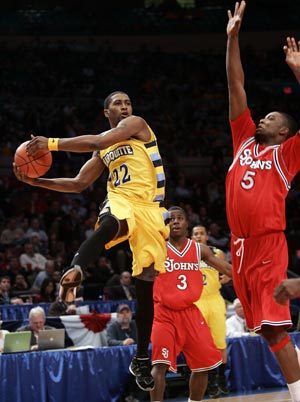 Marquette University's Jerel McNeal (22) looks to pass on St. John's University defender Sean Evans (5) in the first half of their game at the 2009 NCAA Big East men's college basketball tournament in New York March 11, 2009.
