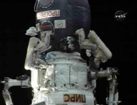 International Space Station (ISS) Commander Mike Fincke (L) and Flight Engineer Yury Lonchakov work outside the Russian segment of the station during their spacewalk from the orbiting laboratory in this March 10, 2009 image from NASA TV. 