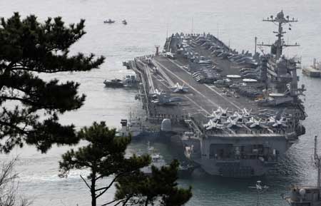 U.S. aircraft carrier USS John C. Stennis arrives at a South Korean naval base in Busan, about 420 km (262 miles) southeast of Seoul, March 11, 2009. The U.S. aircraft carrier made a routine port call in South Korea on Wednesday to take part in a naval drill which is part of the Foal Eagle portion of the annual Key Resolve/Foal Eagle military exercises by the U.S. and South Korea. The joint drills began on Monday and will run until March 20 across the South. 