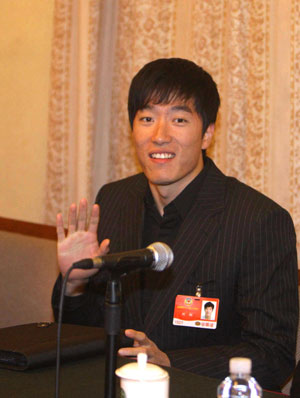 Chinese hurdler Liu Xiang, who is a member of the 11th National Committee of the Chinese People's Political Consultative Conference (CPPCC), attends a panel discussion in Beijing, March 11, 2009. 