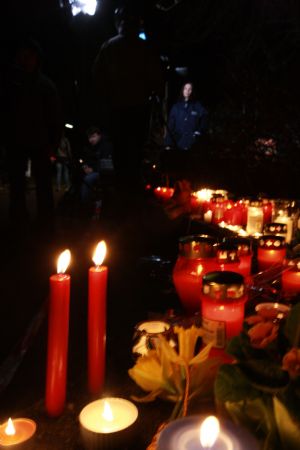 Relatives and friends of victims mourn for the dead with flowers, candles and letters near the Albertville high school in the town of Winnenden near the southwestern German city of Stuttgart, March 11, 2009. 