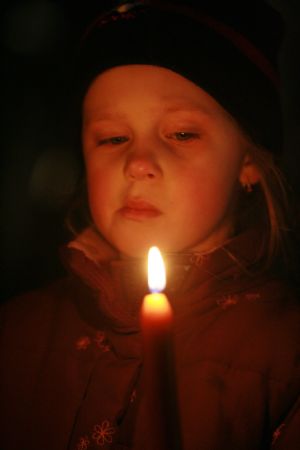 Relatives and friends of victims mourn for the dead near the Albertville high school in the town of Winnenden near the southwestern German city of Stuttgart, March 11, 2009. 